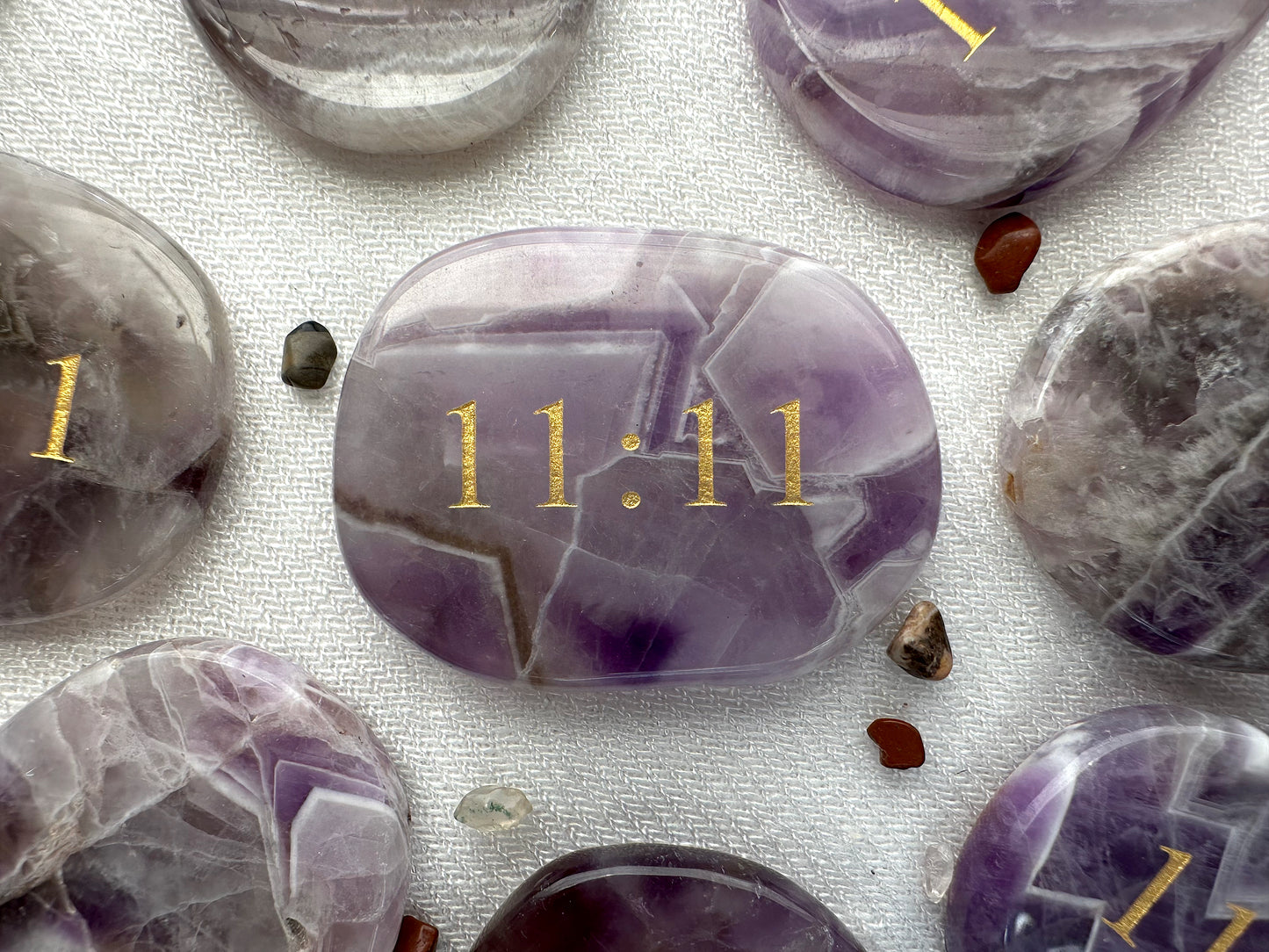 Purple amethyst palm stone. Flat palm stone with 11:11 engraved in gold
