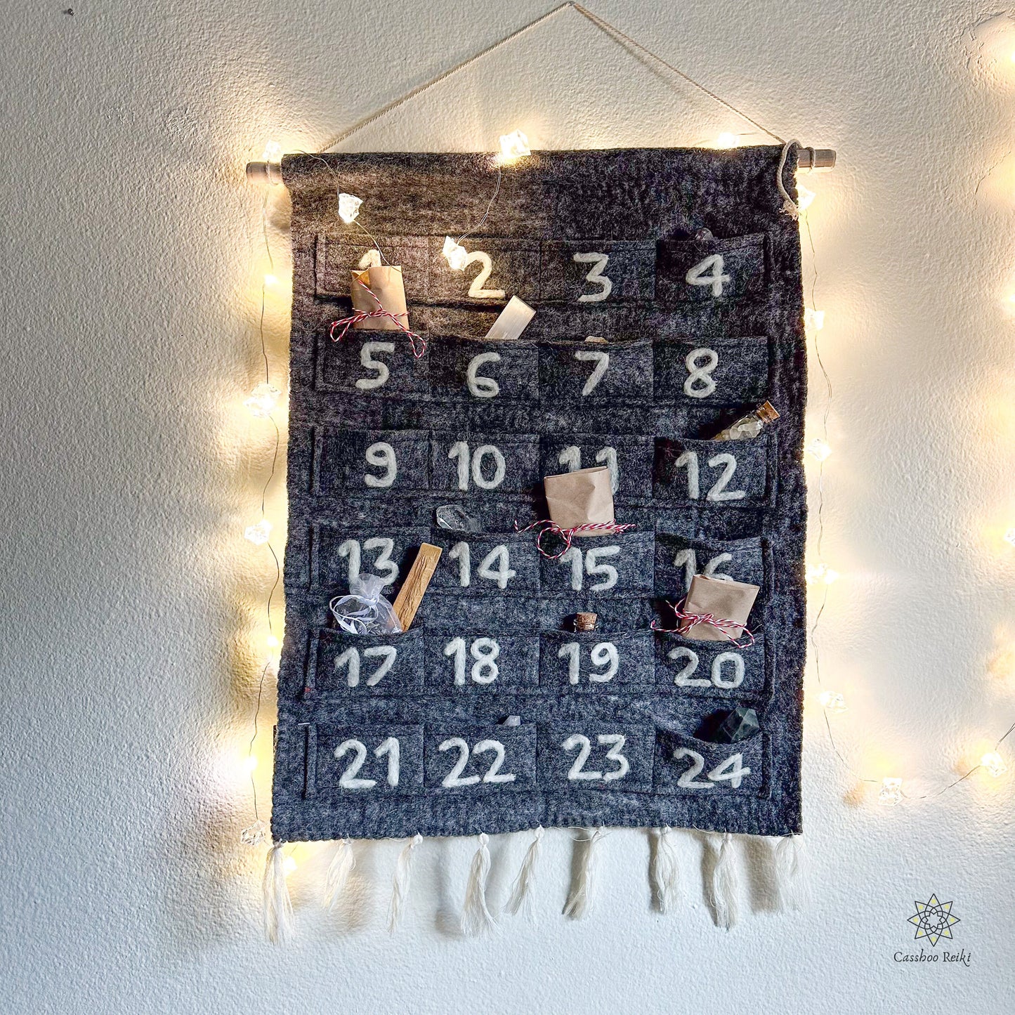felt fabric advent calendar, with 24 small pockets and small presents in each pockets